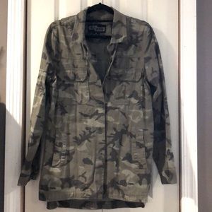 Camouflage button down shirt.